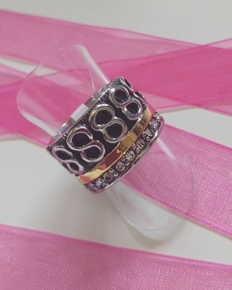 Anel bicolor, em aço, com zirconias e infinitos. T17