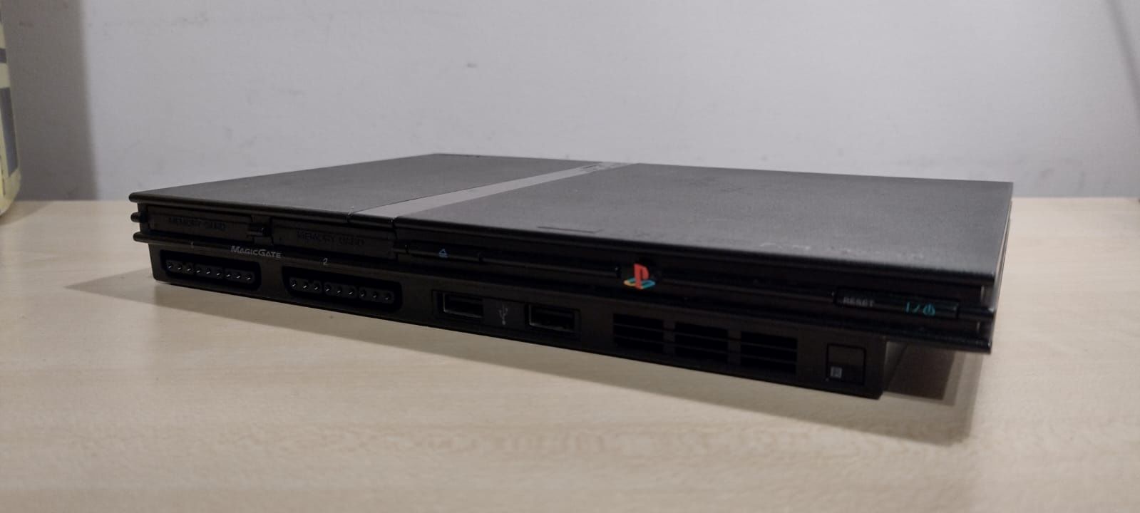 PlayStation 2 Slim + Gry + 4x Buzz + Swap Magic + Eye Toy + Pudełko