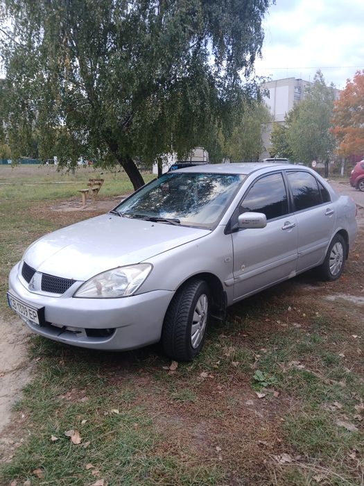 Mitsubishi  Lancer 9 ( 1.6)