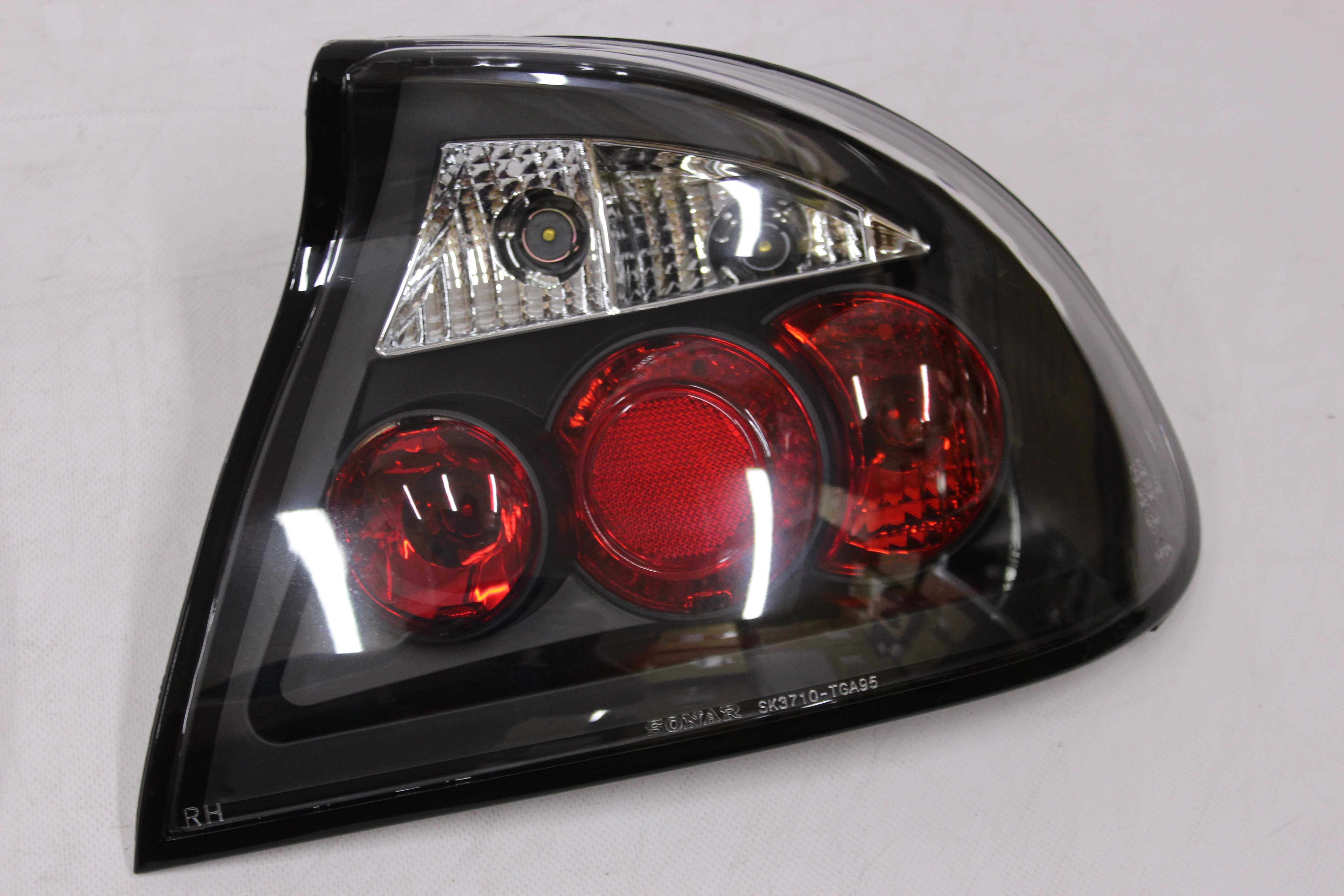 Lampy światła tył tylne OPEL TIGRA 94-00 Black TUNING SMOKE NOWE
