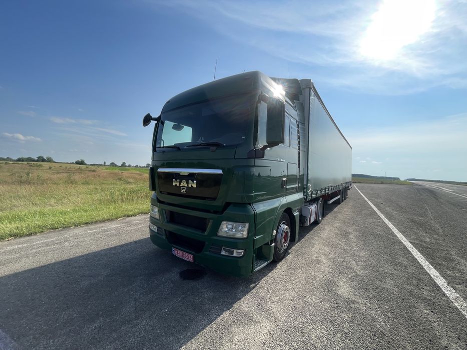 Тягач Man TGX 18.440 MEGA + напівпричіп штора Kassbohrer осі SAF