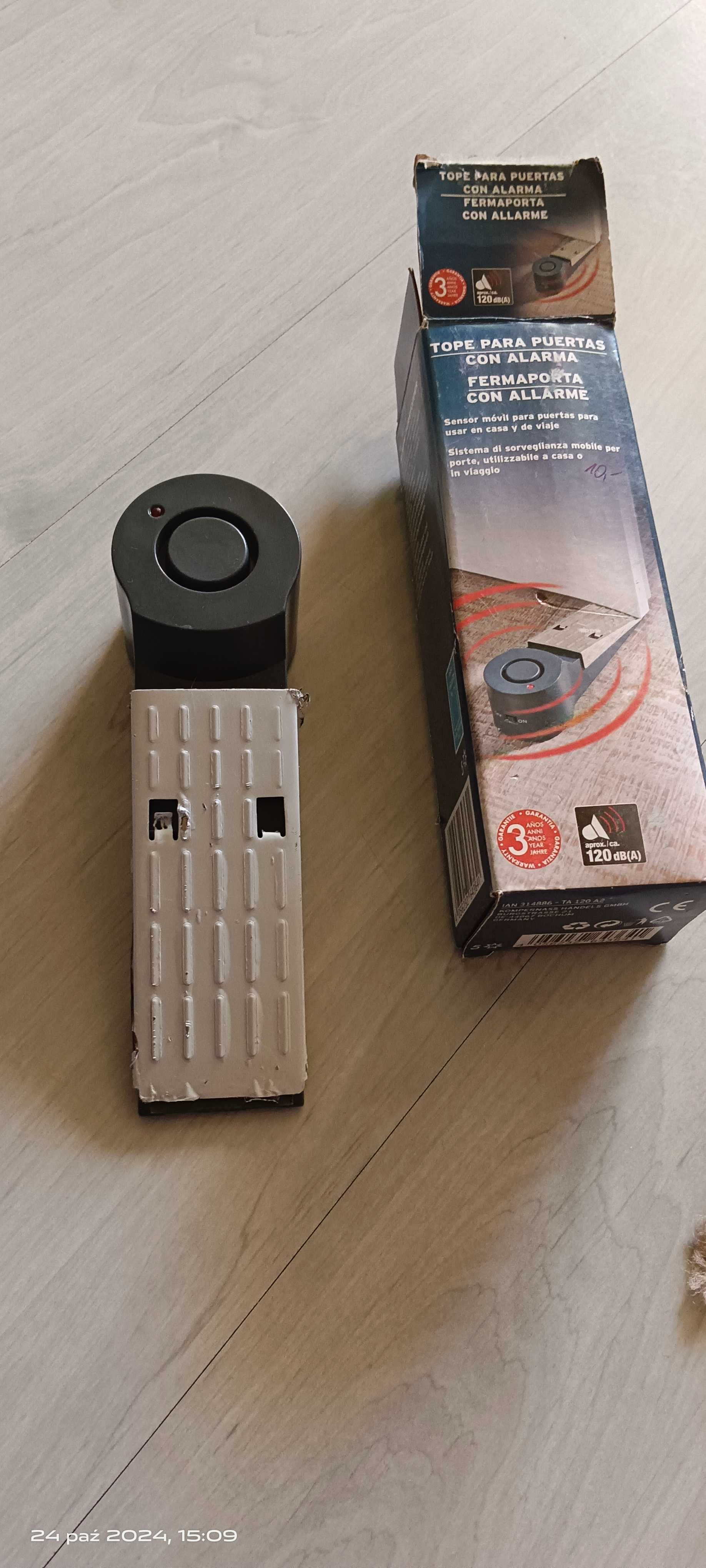 Alarm pod drzwi zabezpieczający .