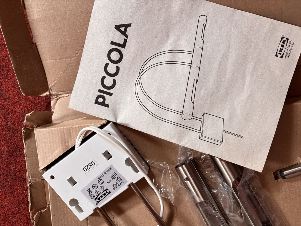 Nowa lampa ścienna IKEA nad obraz Piccola
