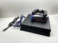 Playstation 4 1TB + pad + 4 gry