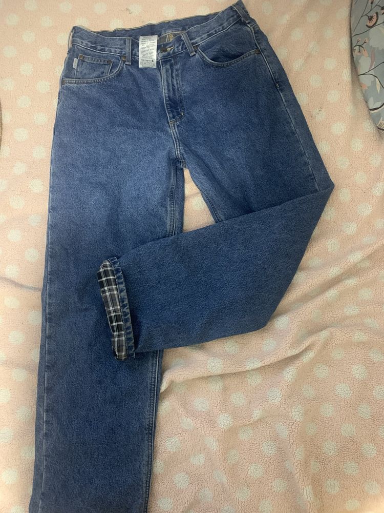 Spodnie oryginalnie  jeansy Carhartt w rozmiarze L