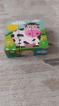 Dwa zestawy puzzle drewniane klocki