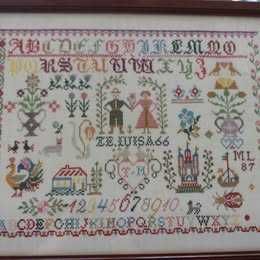 Bordado a ponto cruz .Moldura em madeira