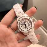 Biały zegarek damski marki Chanel