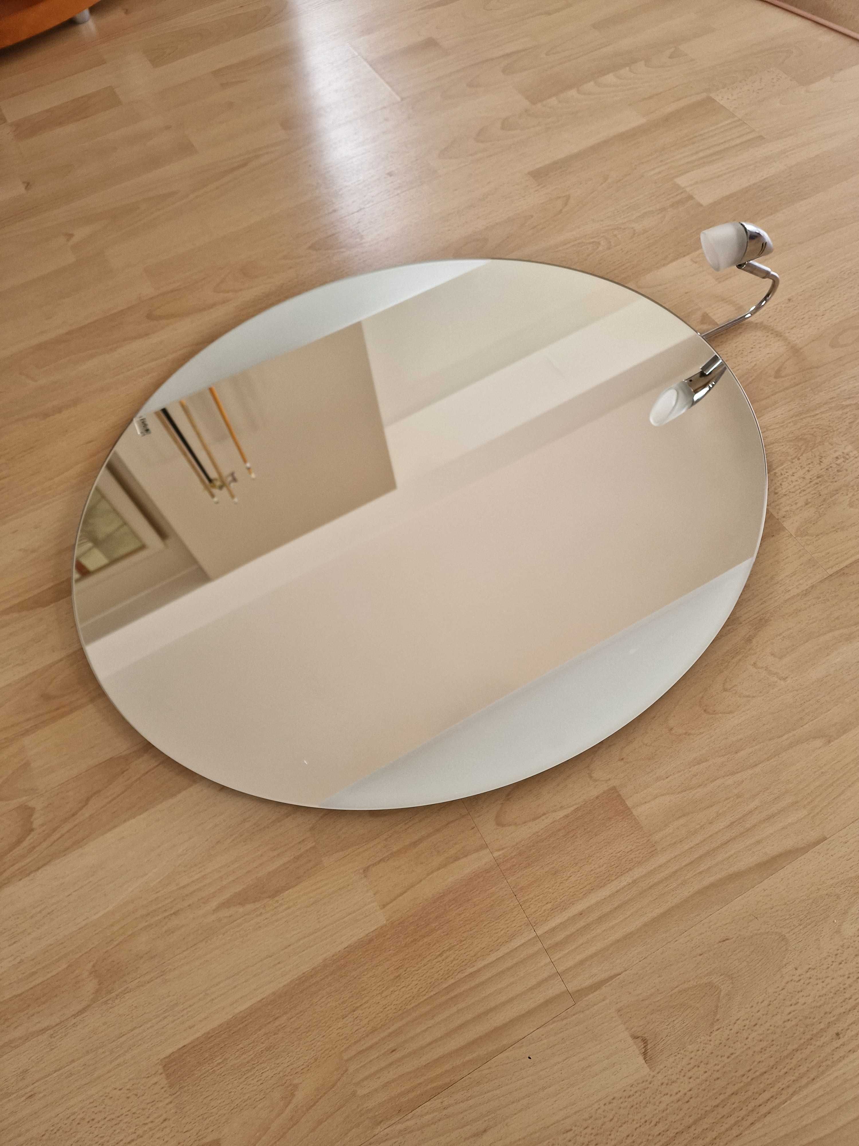 lustro łazienkowe owalne z kinkietem do oświetlenia