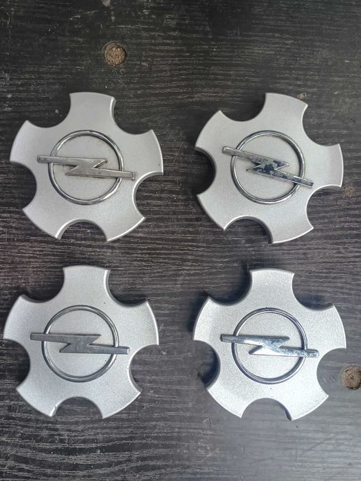 Kołpaczki dekielki felg Opel  110 mm Komplet Oryginał