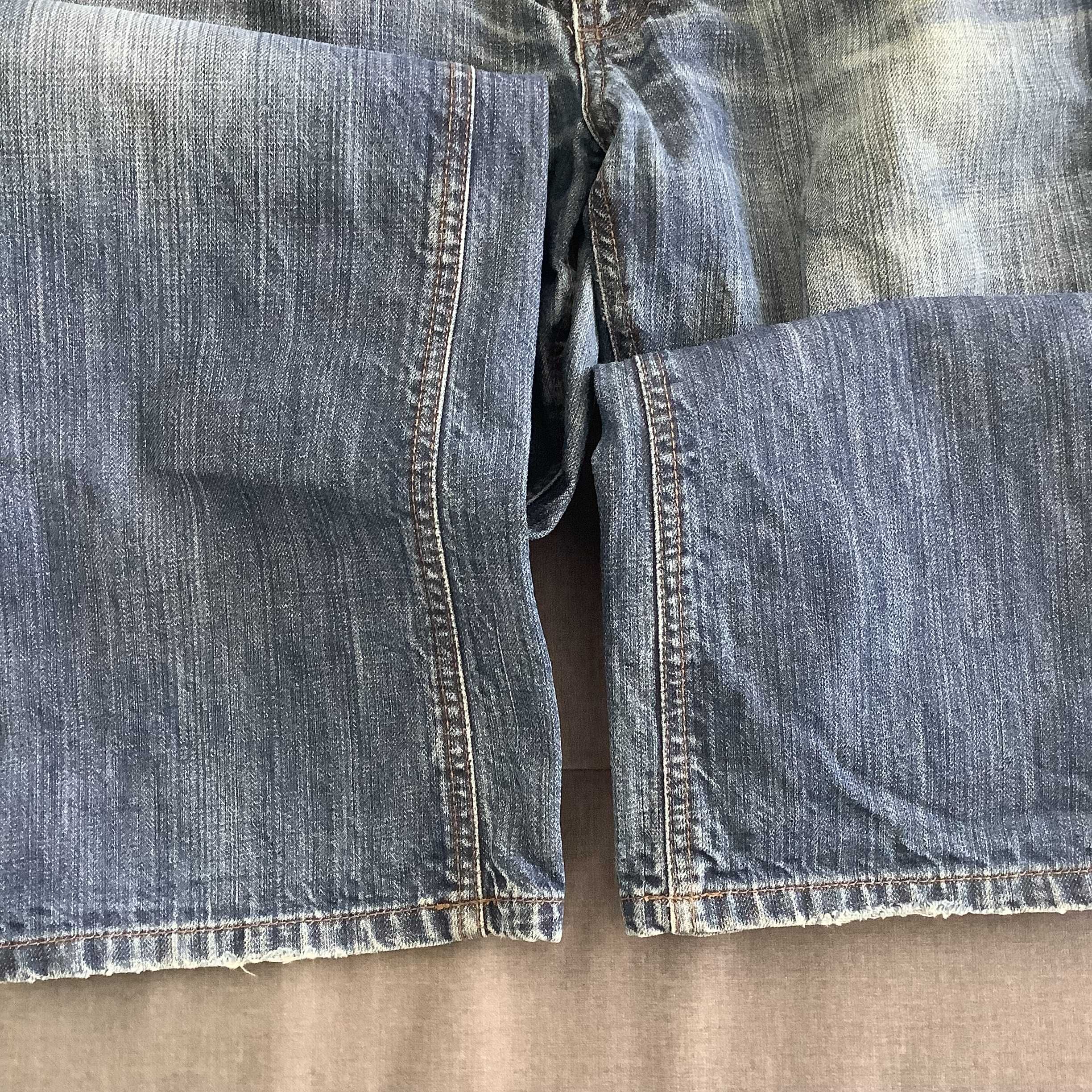 Spodnie męskie jeans 34/32 z wyprzedaży w USA