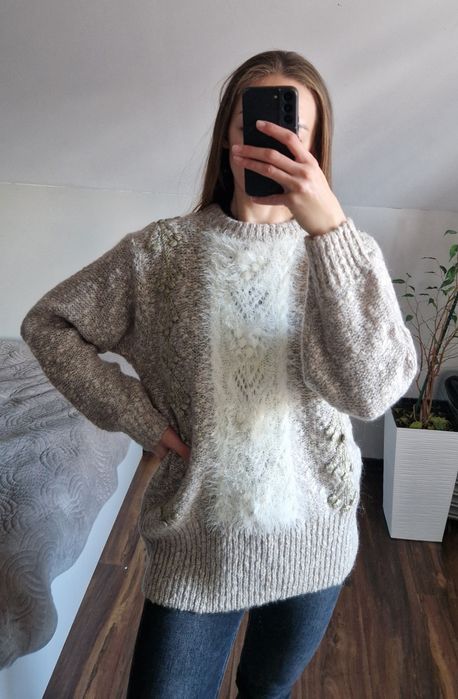 Elegancki i ponadczasowy sweter wykonany z luksusowej wełny