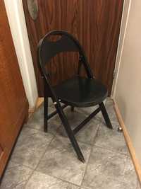 Stare krzesło składane czarne