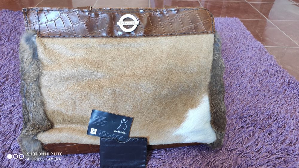 Mala/carteira em pele