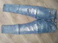 Reserved jasnoniebieskie jeansy z przetarciami, rozmiar 40