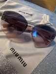 Okulary damskie Miu Miu