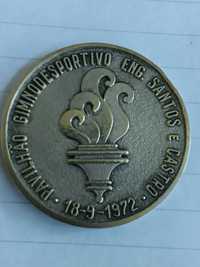 10 fichas de telefone e uma medalha do Atlético Clube de Portugal