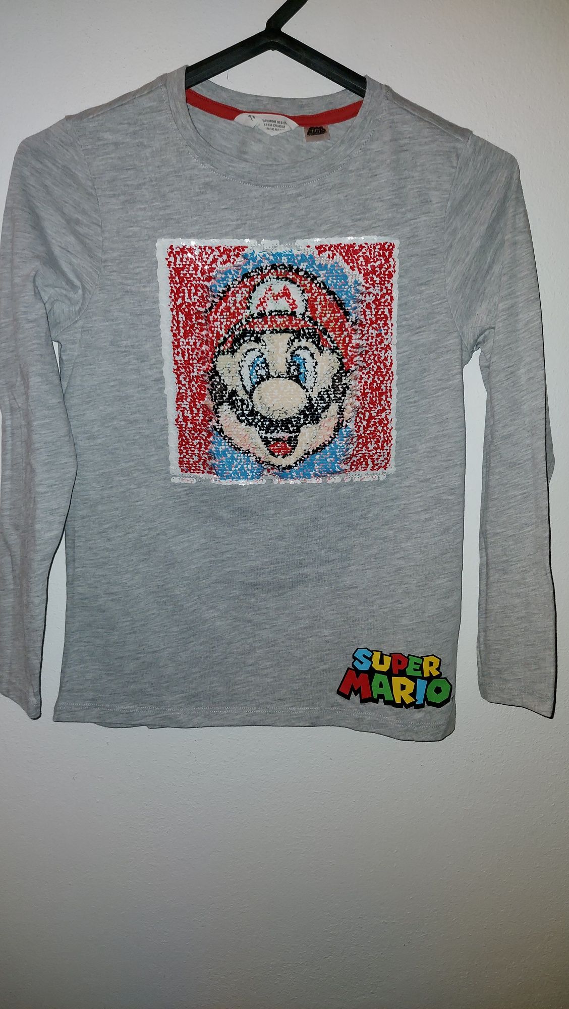 Camisola manga comprida Super Mario 
Nova
8-10 anos
Com lantejolas - S