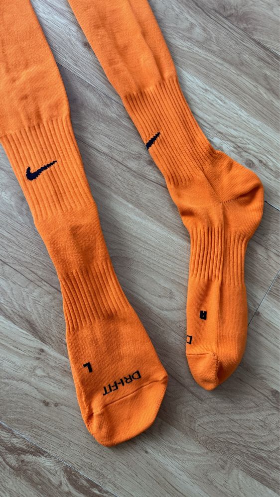 Długie getry piłkarskie Nike pomarańczowe