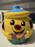 Garnuszek na klocuszek Fisher Price