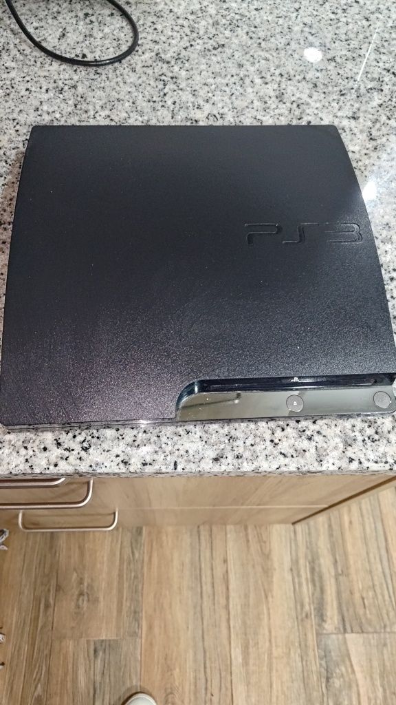 PS3 com vários jogos