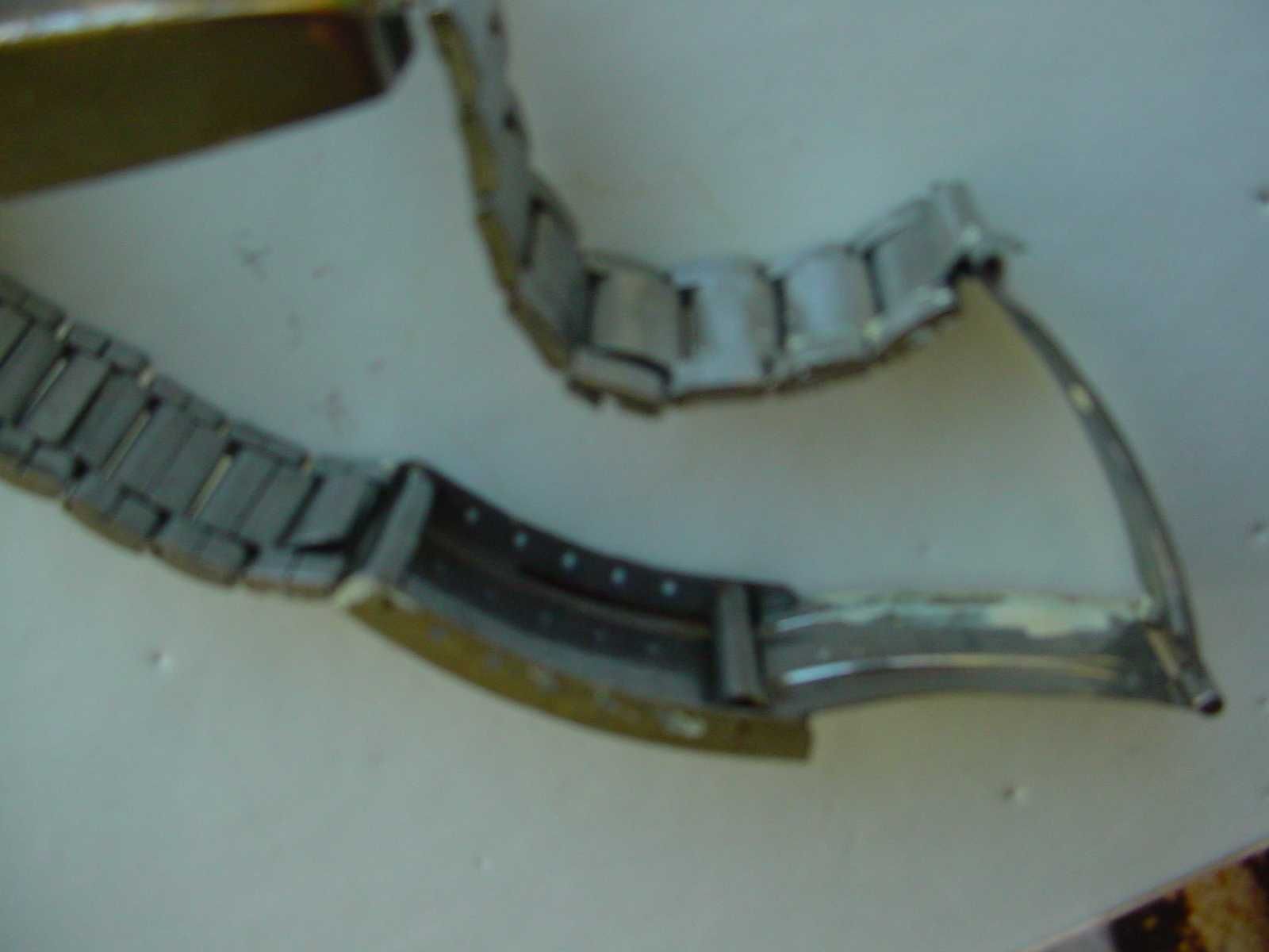 Bracelete de relógio, metálica.