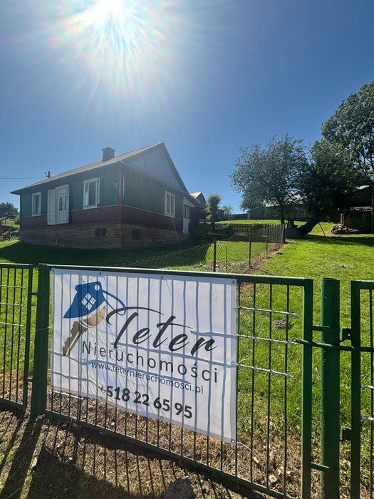 Nieruchomosc zabudowana domem w spokojnej okolicy z budynkami