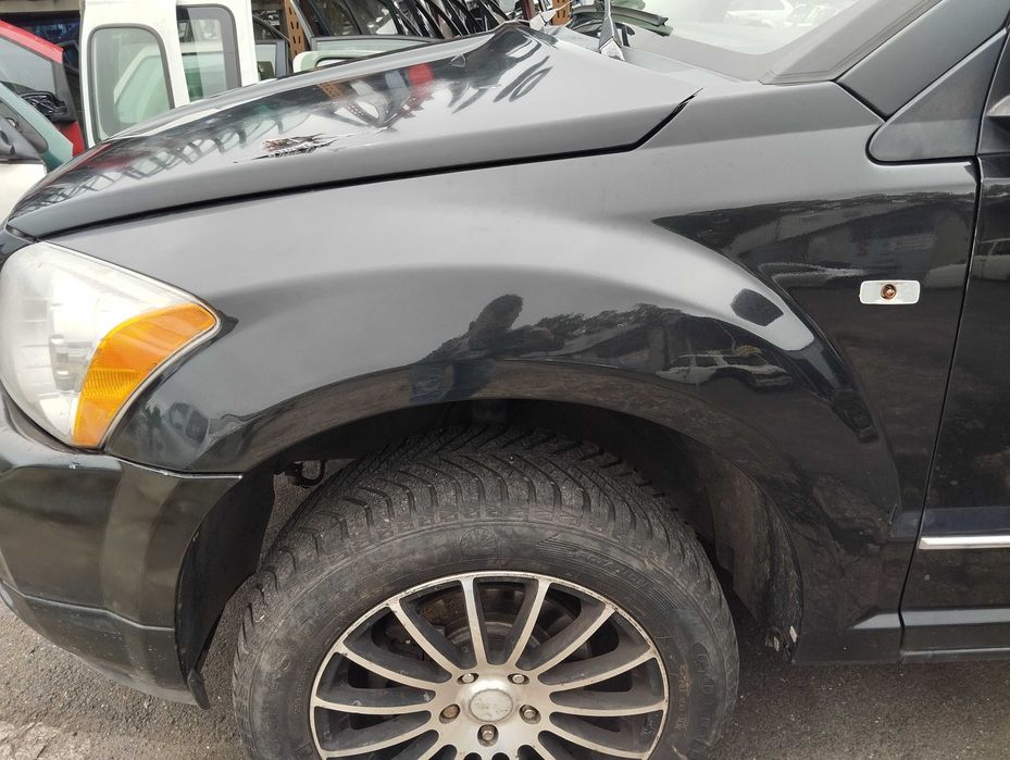Dodge Caliber 2.0CRD 2006r.Błotnik przedni lewy.