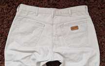 Beżowe spodnie męskie jeans Wrangler Texas W36L32