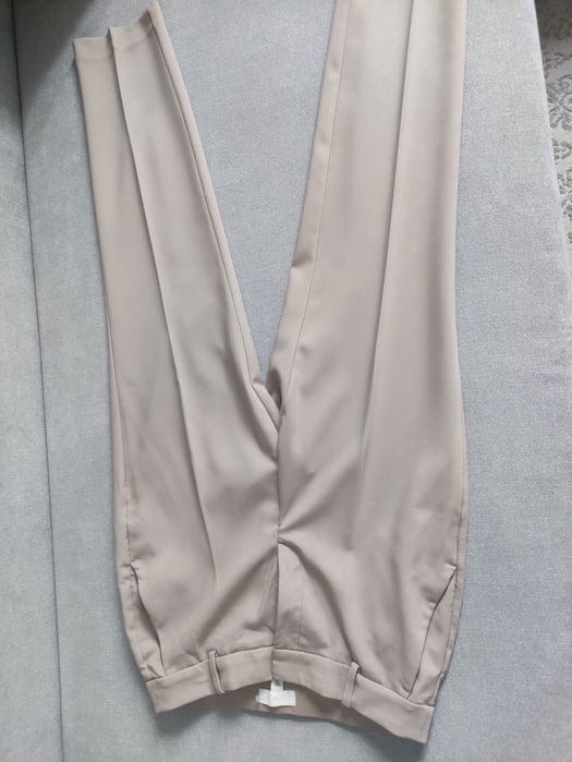 Eleganckie beżowe spodnie w kant  H&M