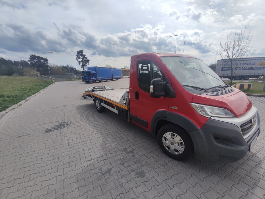 Pomoc drogowa holowanie laweta transport 24/7 tanio