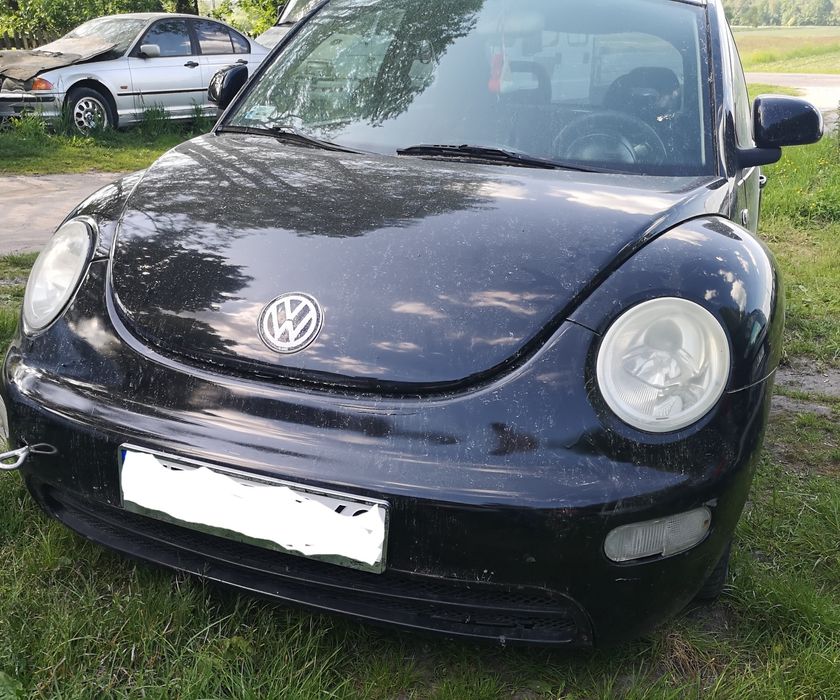 VW New Beetle części od a-z mocowanie okular lampy prawy przód  orygin