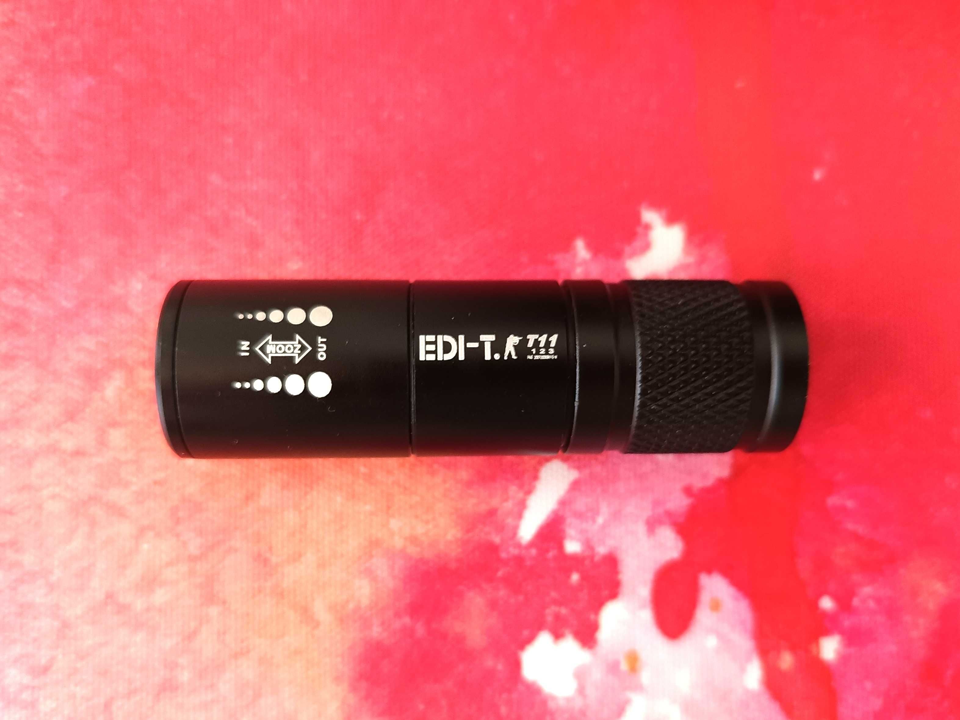 Latarka LED EDI-T11 ZOOM z uchwytem rowerowym. ładowarką i etui, nowa