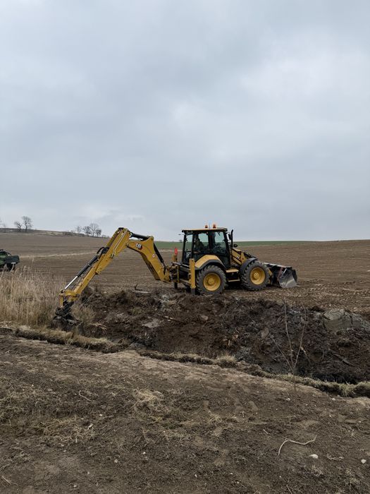 Usługi koparko ładowarką cat 444,prace ziemne,niwelacje,wyburzenia