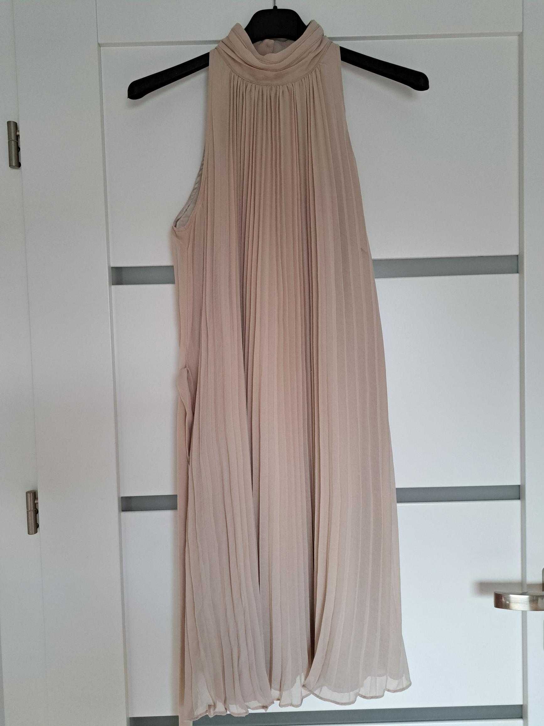 Elegancka sukienka midi z dekoltem typu halter