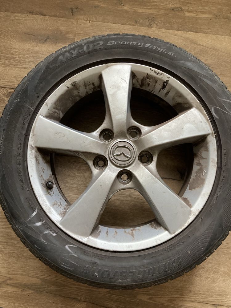 Колеса : диск + шина mazda 3 оригінальні r16 55/205 bridgestone
