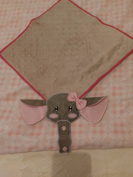 Fralda prende chupeta