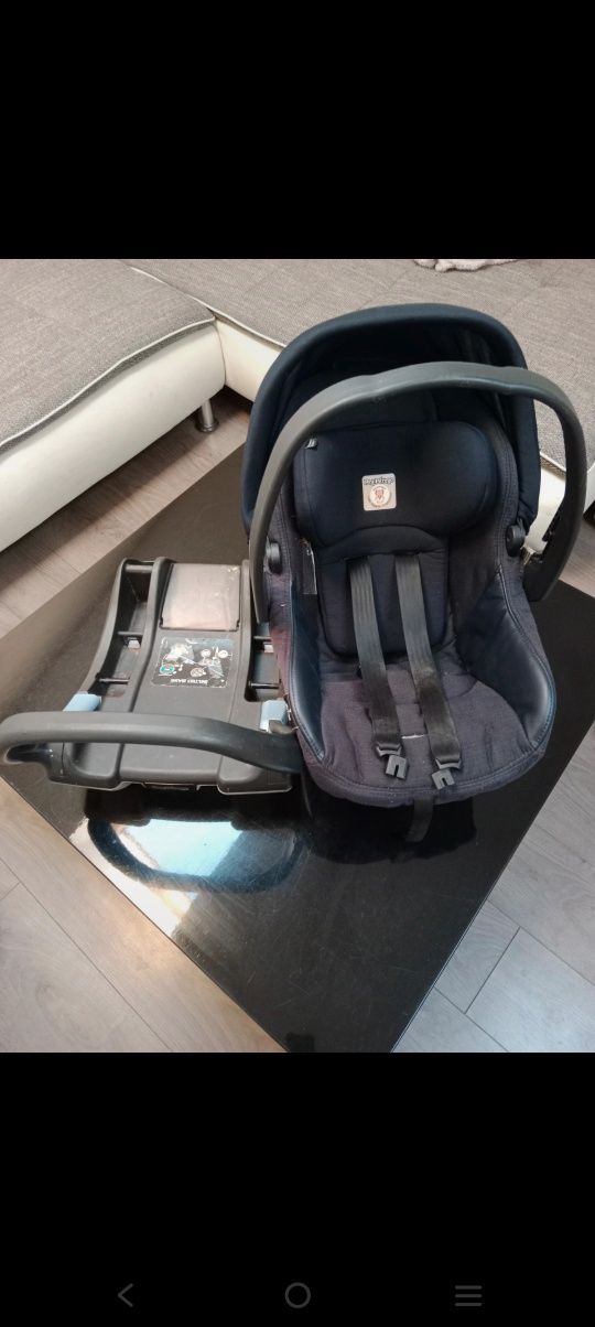 Nosidełko / fotelik z bazą na pasy firmy Peg-Perego