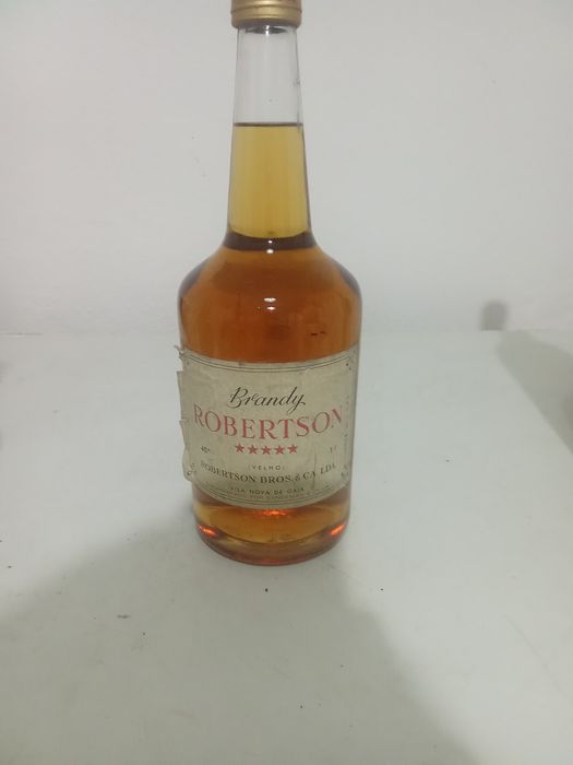 Vendo brandy.garrafa muito antiga em bom estado de conservação.