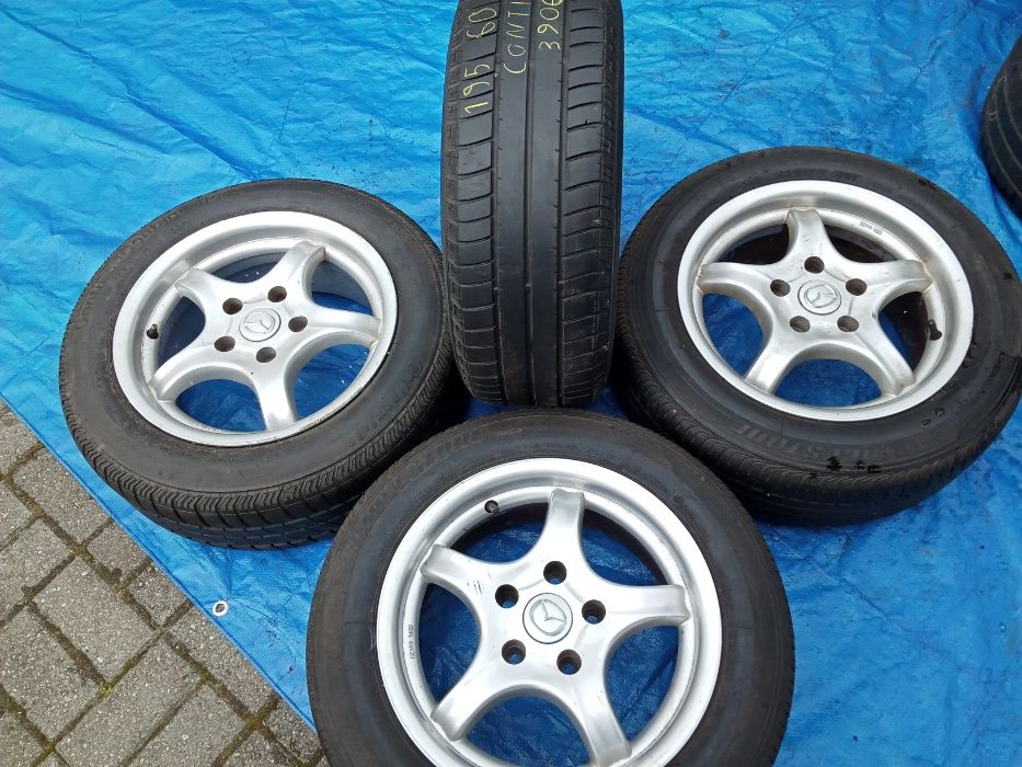 Koła Alu Mazda 7Jx15H2 ET35 Bridgestone/Continental 195/60R15 letnie