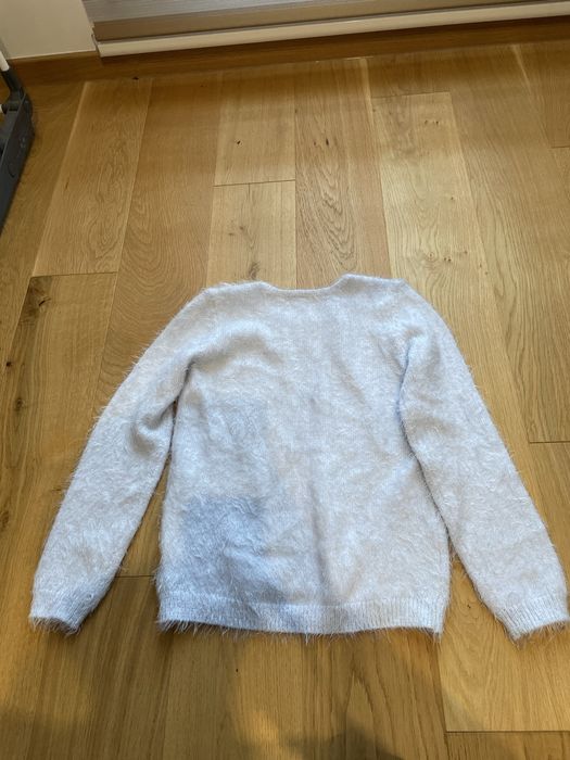Jasnoniebieski polyskujacy sweterek H&M