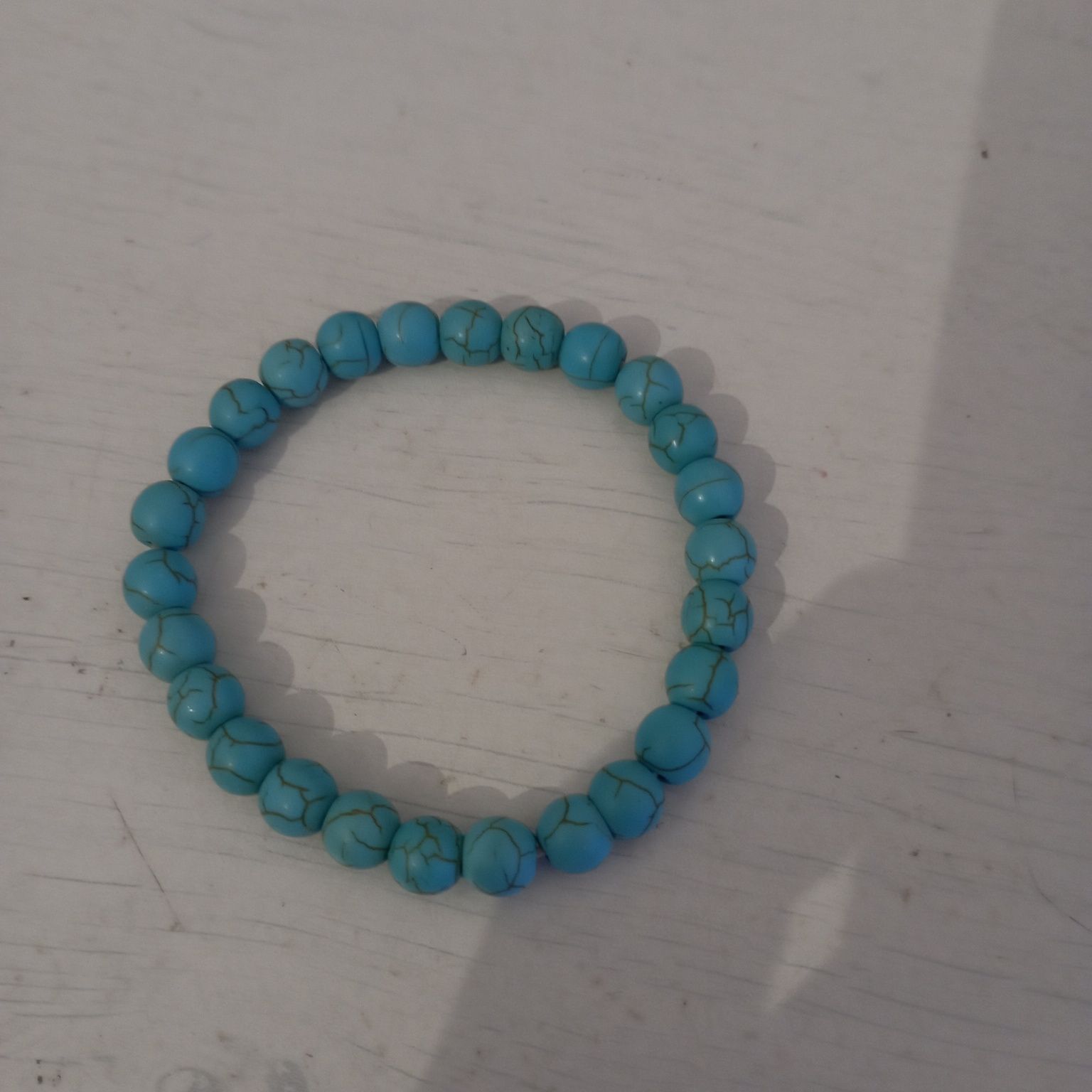 Pulseira com pedras azul claro