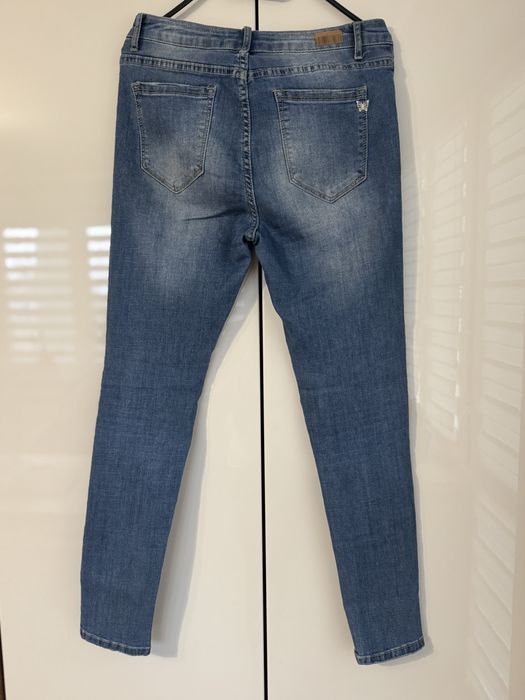 Jeansy damskie z rozdarciami rozmiar L