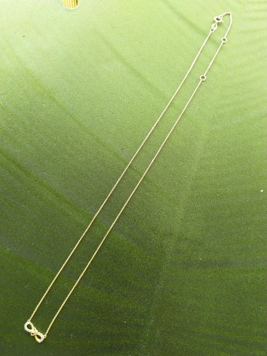 Złoty naszyjnik nieskończoność z sercem