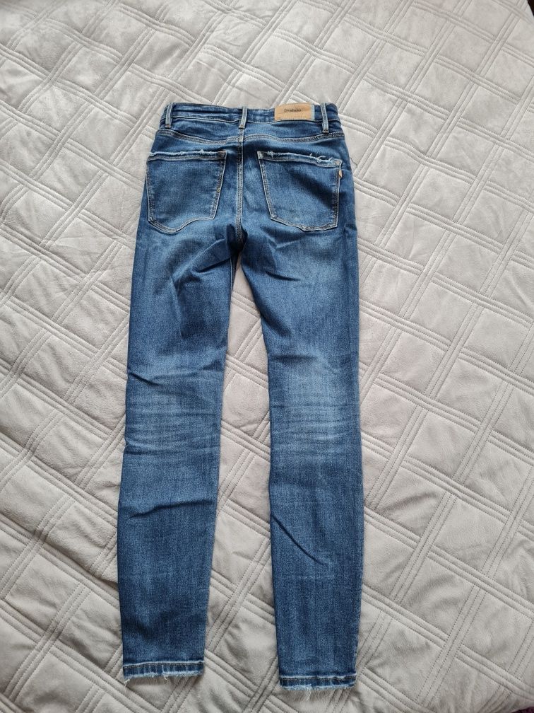 Spodnie jeansy 34 Stradivarius