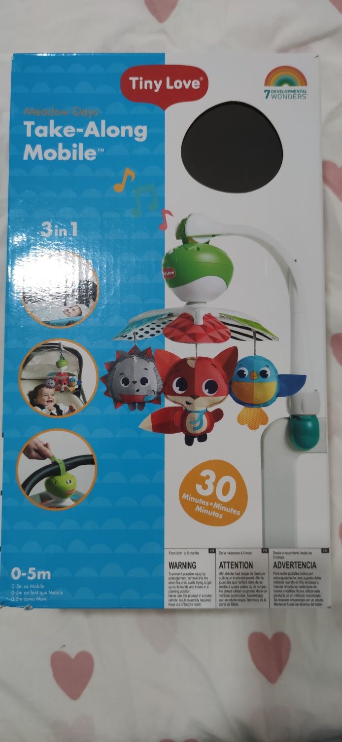 Brinquedo com músicas berço Next2me...
Em pe
