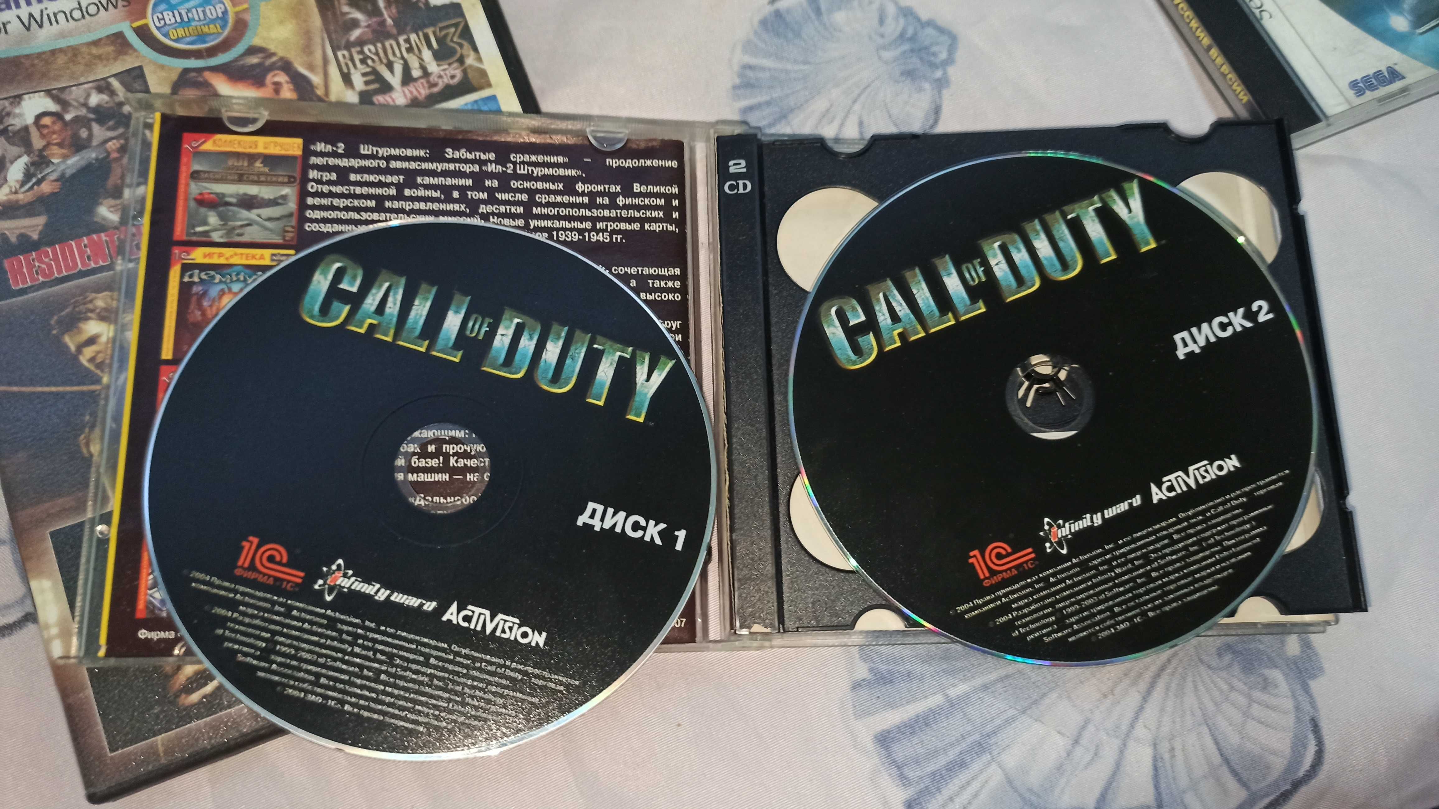 Комплект дисков с играми Call of Duty , Quake , Resident Evil