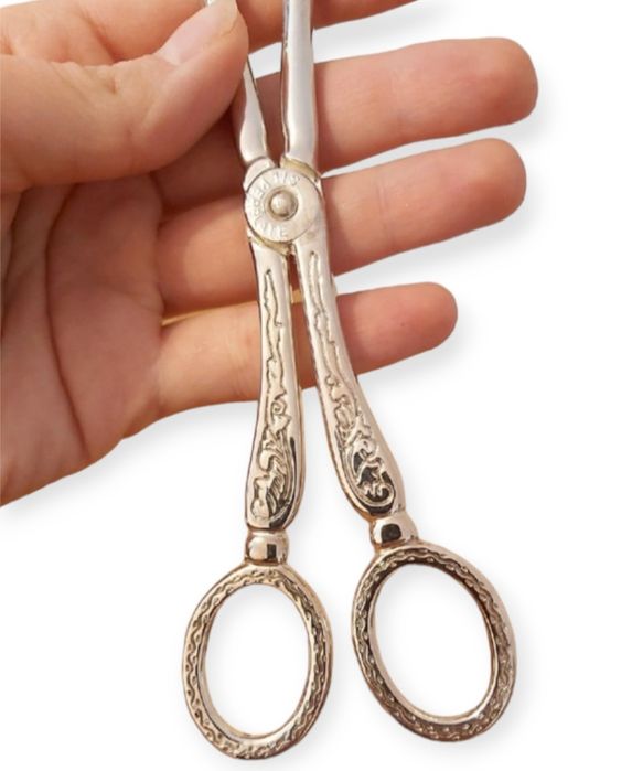 Щипцы  посеребренные для выпечки .