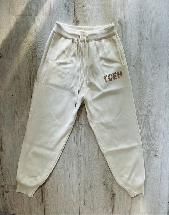 Kremowe spodnie dresowe z kryształkami – skrzydła anioła