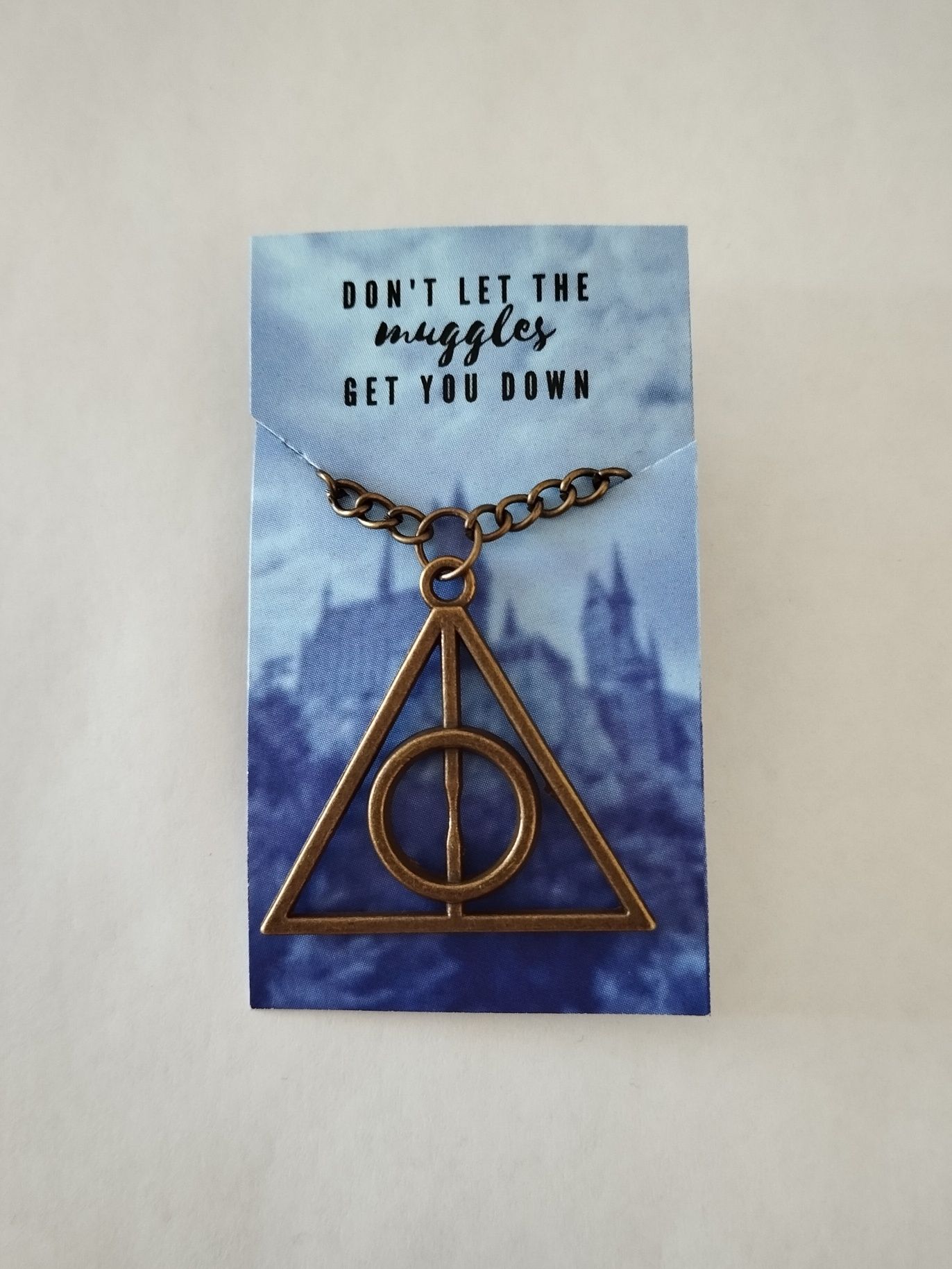 Colar Deathly Hallows Harry Potter disponível em 3 cores 
Novo e nunca